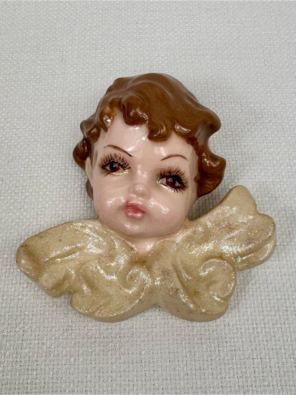Glazed Ceramic Cherub Wall Accent in Brown and Gold